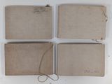 four pieces of paper with a string and a tag on them