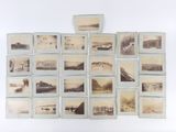 a lot of old photos on the wall of a room