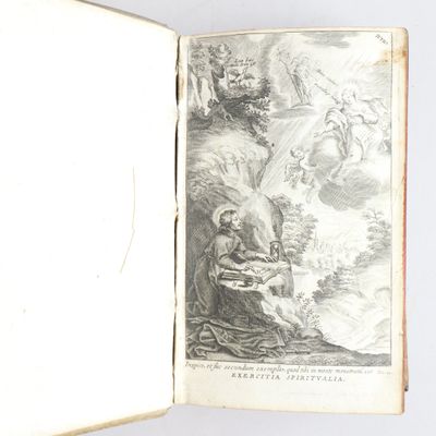 un livre ouvert sur lequel figure le dessin d'un homme et d'une femme dans un paysage