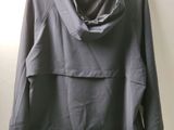 an image of a gray jacket hanging on a hanger