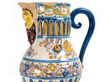 a blue and white vase with a bird on it