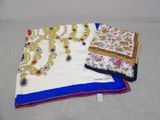 two pieces of white and blue embroidered sari with blue border