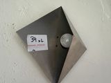 a light that is on the wall with a sticker on it