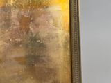an old picture frame with a picture of a man and a woman
