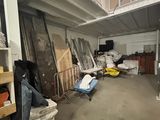 an image of a room with a lot of stuff on the floor