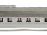 a silver train car that is sitting on the tracks