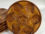 a lot of plates that are sitting on a table