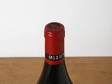 a bottle of wine that is sitting on a table