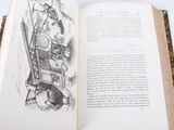an open book with a drawing of a man sitting on a chair