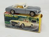 a toy car that is sitting on top of a box