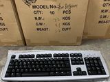 a keyboard and a mouse on the floor in front of boxes