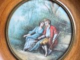 a picture of a picture of a man and a woman sitting on a bench