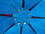 a blue umbrella with red trims on a blue surface