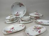 many plates and bowls that are sitting on a table