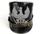 a black hat with a silver eagle on it