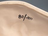a close up view of a white vase with numbers on it