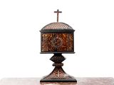 a small table with a cross on top of it