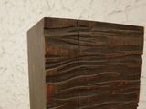 a wooden block that has been carved into the shape of a wave