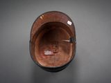 a close up view of a brown hat on a table