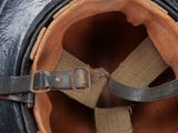 a close up of a helmet with a strap on it