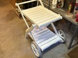 a cart with a table on it in a garage