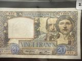 un ancien billet de 20 francs français sur lequel figurent les portraits d'un homme et d'une femme