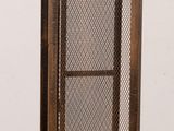 a metal door that has a mesh screen on it