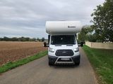 a white rv parked on the side of the road