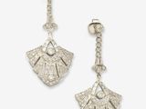 a pair of diamond and silver earrings