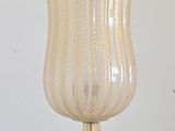 a glass vase that is sitting on a table