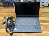 a laptop that is sitting on a wooden table