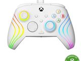 a close up of a controller on a white surface