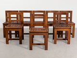 six wooden chairs and a bench in a room