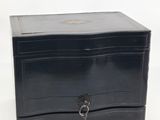 an image of a small black box with a key on it