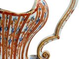a vase with a spiral design on it on a white background