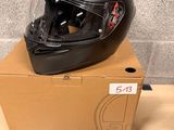 a helmet sitting on top of a box on a table