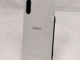 a close up of the back of a white sony phone