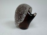 a brown vase with a silver cap on top of it