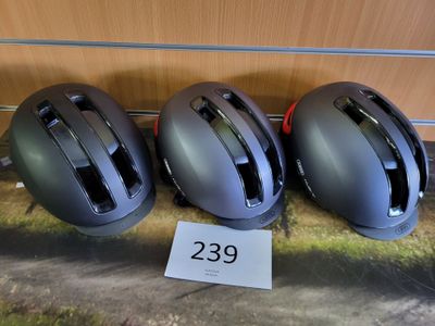 three helmets that are sitting on a table