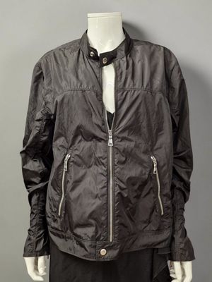 an image of a mannequin mannequin wearing a black jacket and skirt