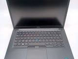 a laptop that is sitting on a white table