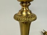 a gold vase that is sitting on a table