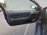a car door open with the driver ' s side door open
