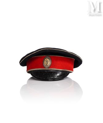 a red hat with a gold emblem on it