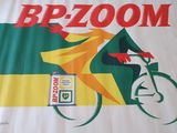 a bicyclist riding a bike with a sign on it