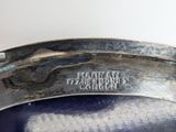 an image of a close up of a metal bowl with a label on it