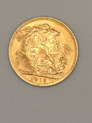 une pièce d'or sur laquelle est représenté un homme à cheval