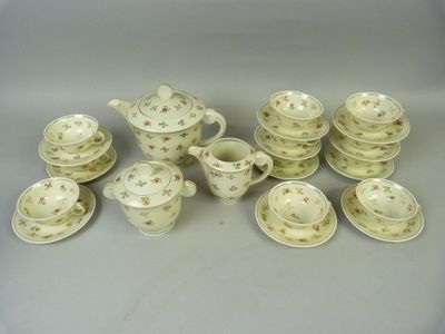 an image of a group of porcelain tea and coffee cups and saucers