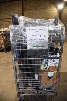 a metal cart with a sign on top of it in a warehouse