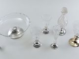 a lot of glass items that are sitting on a table